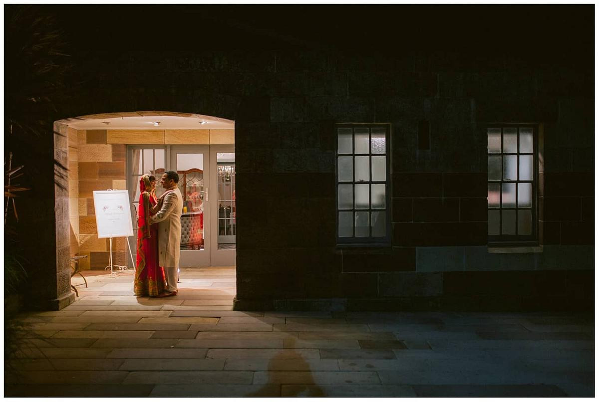 Bride and groom posing in front of historic Gunners Barracks Mosman.