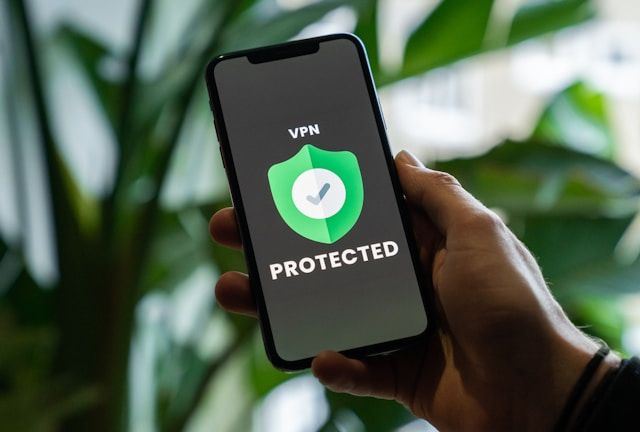 A cell phone that display text that says protected. And a security logo